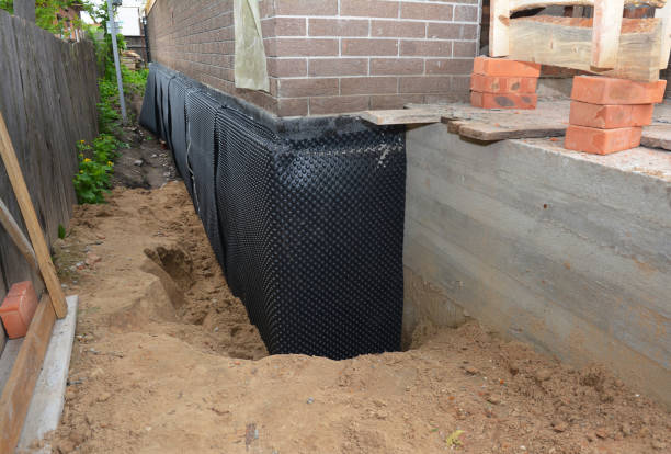 Happy homeowners after waterproofing job in North Judson